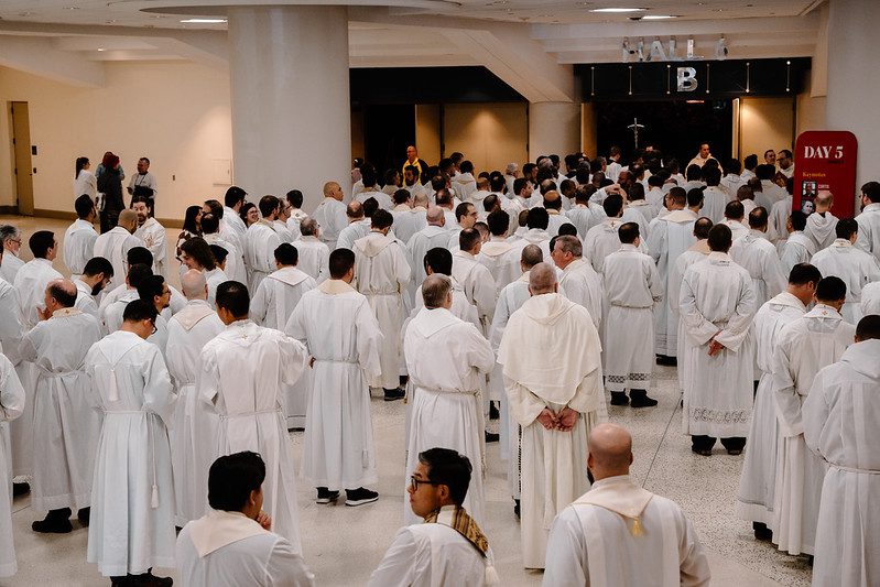 A group of priests prepare for mass at FOCUS SEEK conference