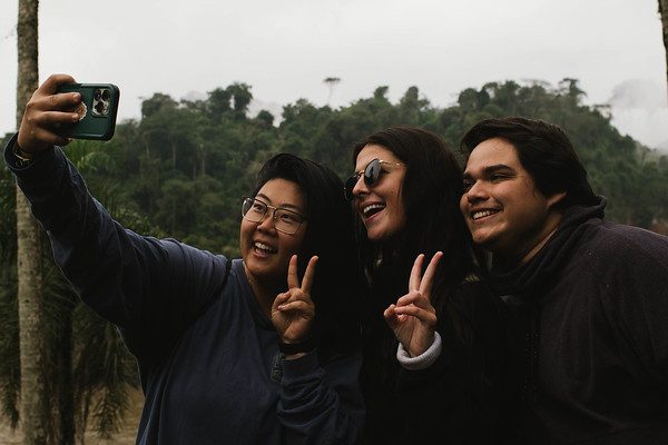 Students taking a selfie during a Catholic South American mission trip. 