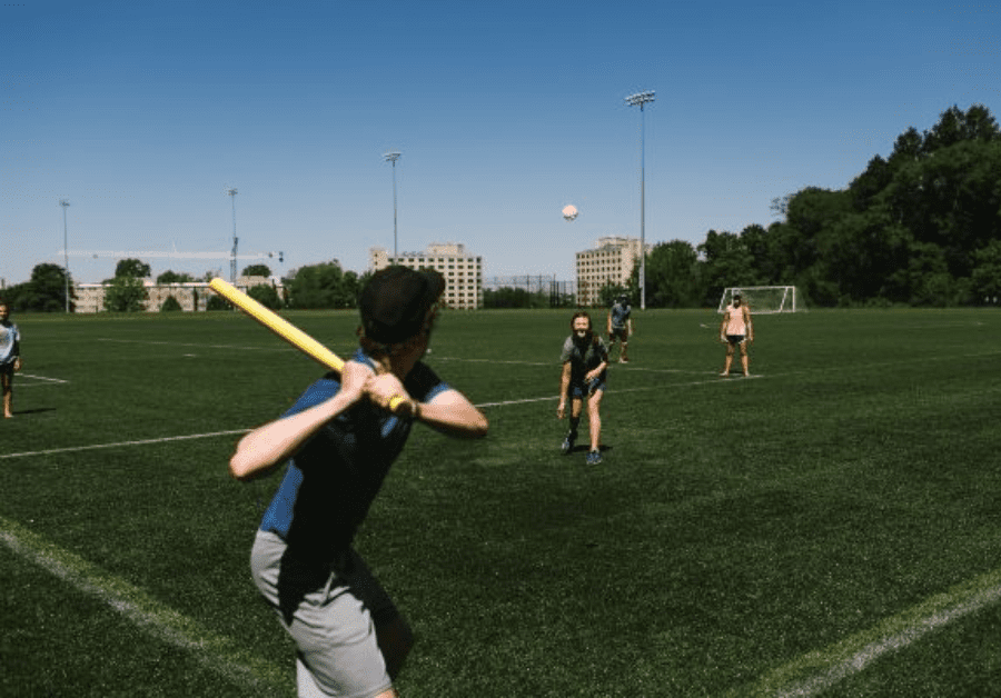 Friends play baseball while following the "Universal Call to Rest" and taking a break form work. 