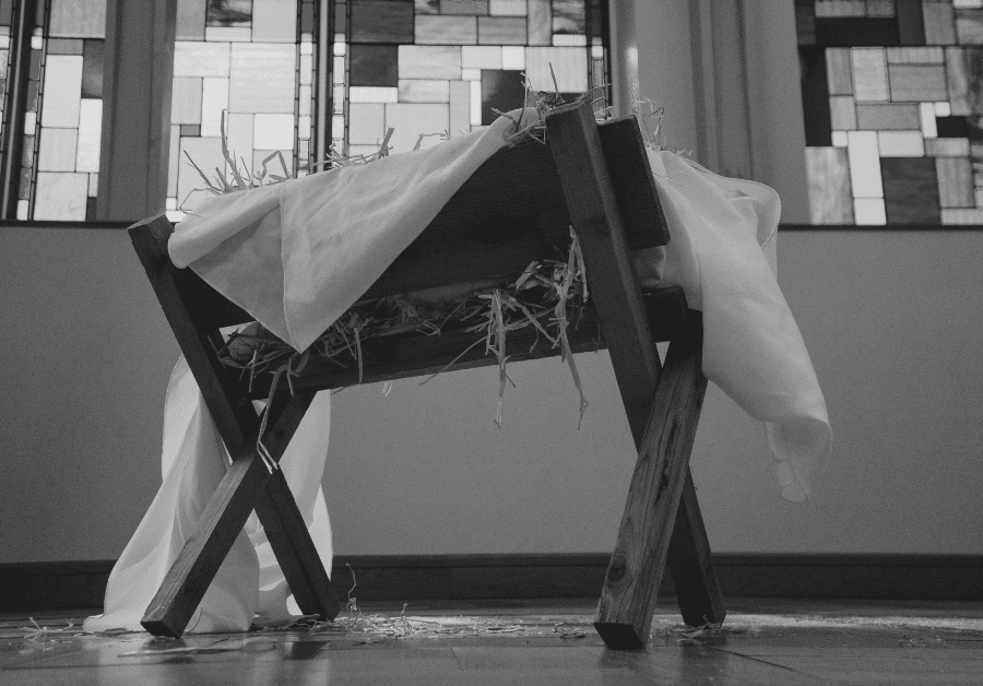 A nativity manger sits in a church during Advent