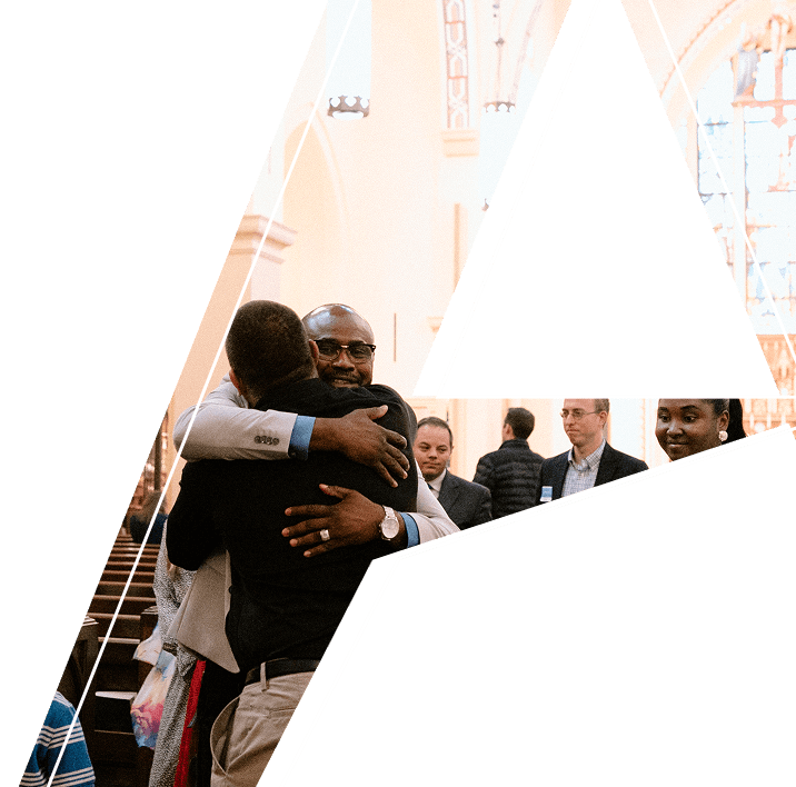 two men hugging in a church
