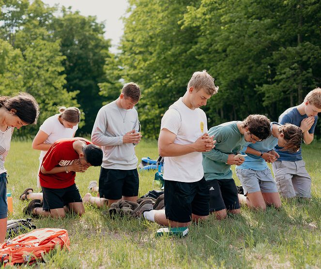 young adults praying
