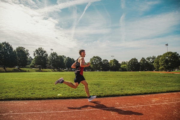 man running on track
