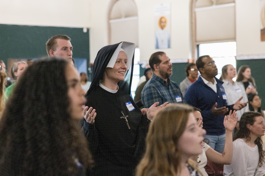 worshipers and nun praying in church